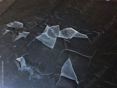 Peeling and cracked car hood paint showing wear, damage, and aging vehicle surface, ideal for texture and maintenance concepts