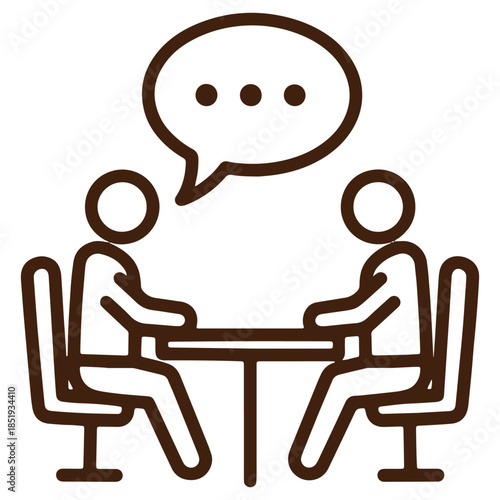 Two people engaged in conversation at a table illustrating communication and discussion