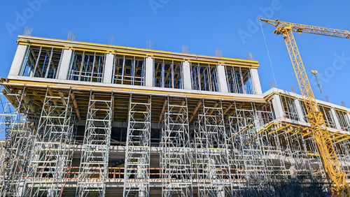 Bild auf Leinwand New building under construction, featuring a multi story concrete structure with