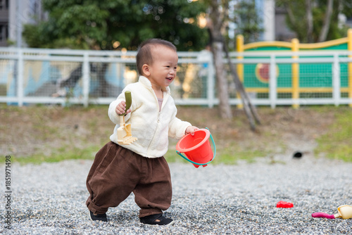 Wallpaper Mural Toddler Playing With Toy Tool At Park Torontodigital.ca