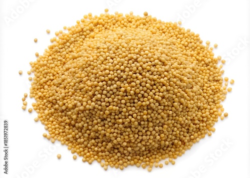 A pile of yellow mustard seeds on a white background isolated on white background
