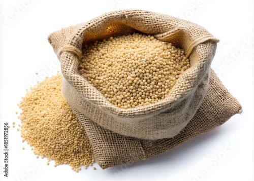 Whole millet grains in a burlap sack isolated on white background