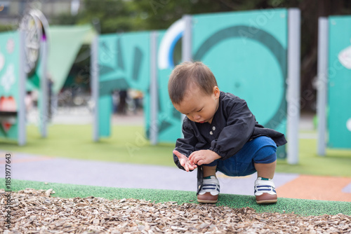 Wallpaper Mural Little baby enjoying outdoor playtime in park Torontodigital.ca