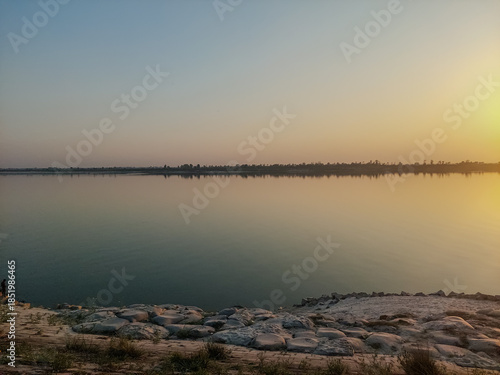 Golden Sunset over Calm River