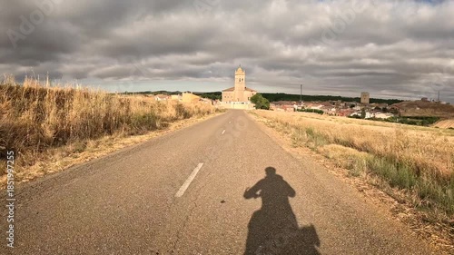 French Way of Saint James - a paved road entering Itero del Castillo, comarca of Odra-Pisuerga, province of Burgos, Castile and Leon, Spain