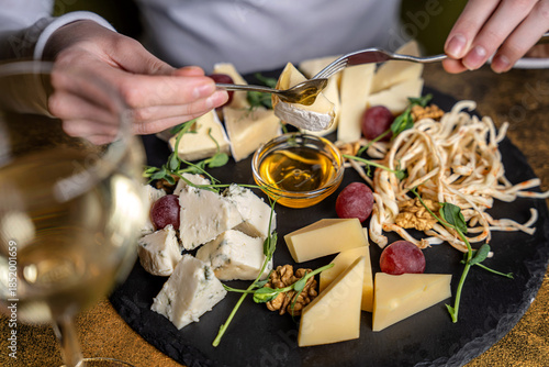 Luxury cheese platter with honey and wine