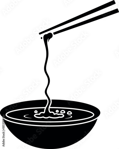 Chopsticks lifting noodles from bowl in black and white