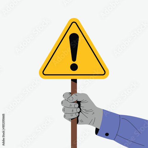 A yellow warning sign held by a hand signaling potential caution
