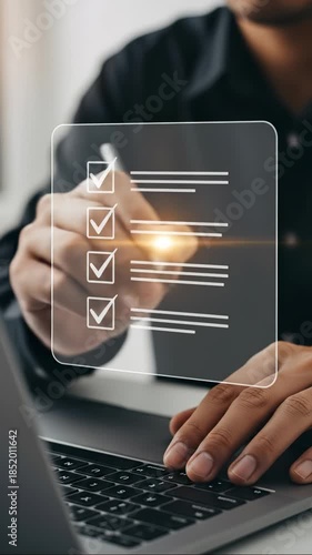 Person Ticking Off Items on a Digital To-Do List Using a Stylus and Laptop