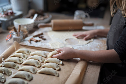 Fotografija Kneading dough and preparing dumplings as a starchy food for meal