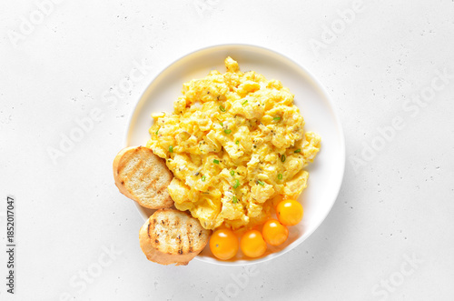 Delicious scrambled eggs on plate