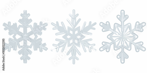 A collection of three delicate white snowflake ornaments against a plain background