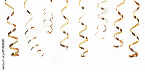Golden streamers hanging against a white background creating a festive atmosphere