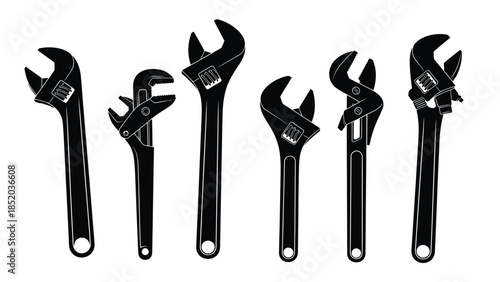 A collection of black adjustable wrenches displayed in a linear arrangement