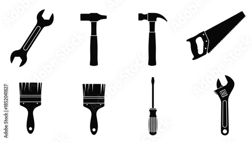 A collection of common hand tools wrenches hammers brushes and screwdrivers