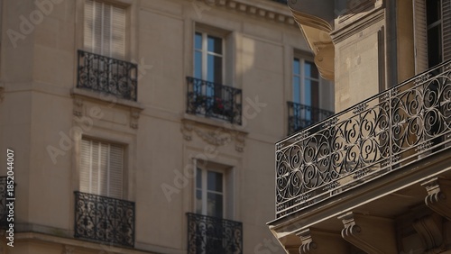 Photography Close-up of Parisian architecture featuring ornate balconies and windows in France