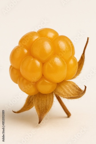 A close-up shows a vibrant yellow fruit cluster, highlighting its natural beauty.