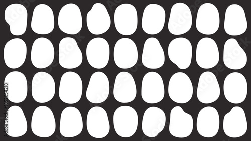 Minimalist abstract pattern with irregular white oval shapes dark