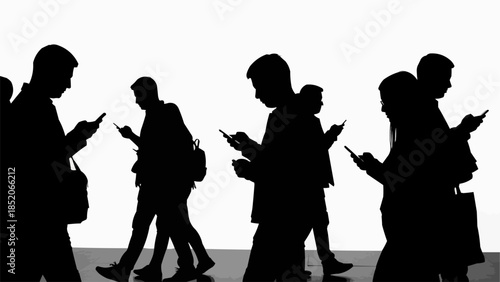 Silhouettes of people engrossed in their smartphones while walking.