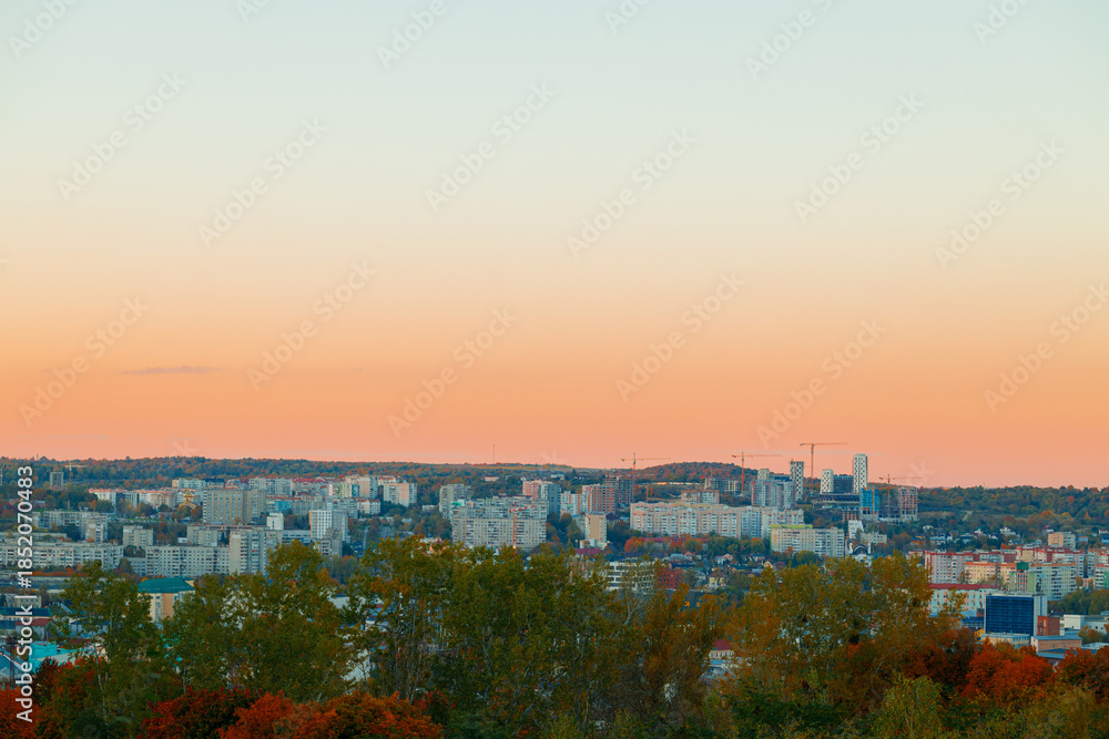Fototapeta premium rustic post USSR Eastern Europe aerial panorama outskirts living city scape building in dusk lighting evening
