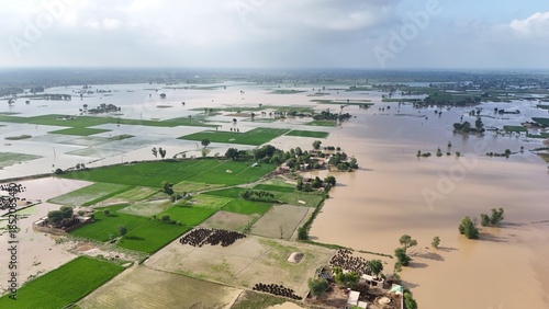 Fotografia Flood in Punjab Drone aerial showing flooded fields aerial view of floodwaters o