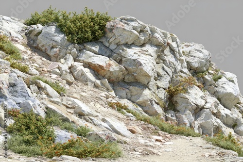 Craggy mountain slope with sparse vegetation and a narrow path.