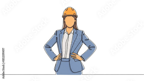 A confident female engineer standing with hands on hips wearing a hard hat in a professional setting