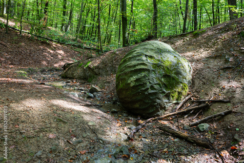 Stone sphere in forest in village Slatina near Banja Luka, mysterious sandstone ball