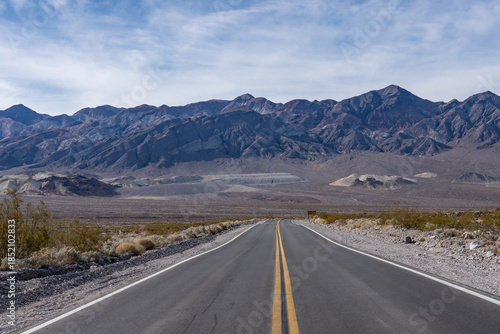 Alluvial deposits.  Death Valley National Park, Inyo County. California State Route 190. In the distance is Black Mountains (Amargosa Range System).