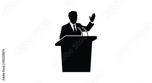 A speaker addressing an audience from a podium captured in a striking black silhouette