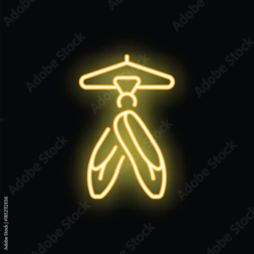 Neon sign illustrating ballet shoes hanging on a hanger, perfect for themes like dance studio or performance