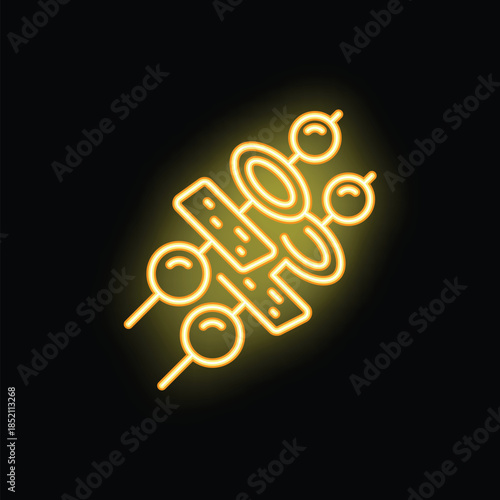 Yellow neon icon illuminating black wall with skewers with meat, vegetable and sausage