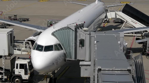 Modern airplane Jet at parking at airport terminal preparing for flight