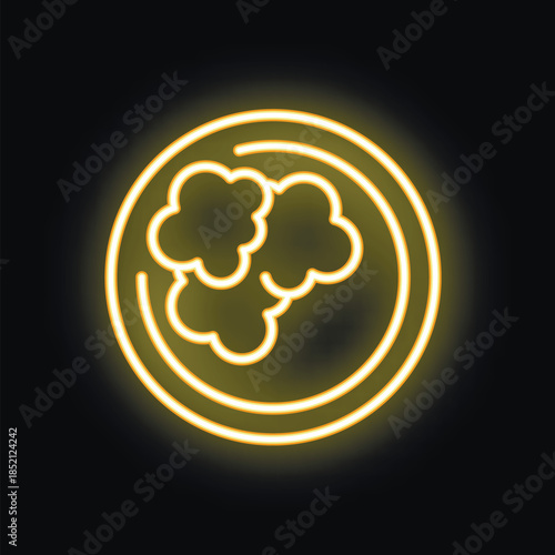 Neon sign of a bowl overflowing with buttery popcorn glowing yellow against a black background