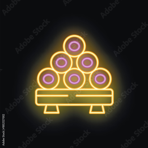 Neon sign illuminating a pile of logs stacked on a wooden platform