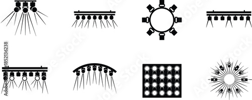 Set of eight black stage lighting and spotlight icons on white background Keywords: spotlight, stage light, lighting, concert