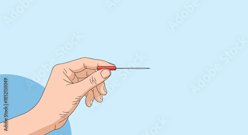 Close-up of a hand gently holding a thin acupuncture needle with a red handle, preparing for an alternative medicine treatment.