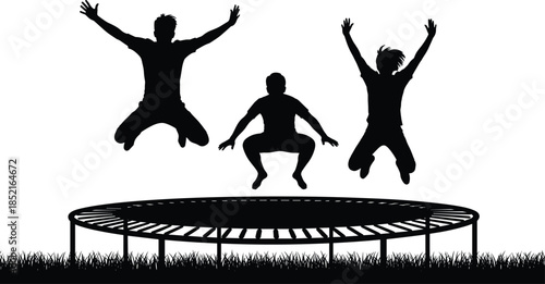 Three black silhouettes of people jumping on a trampoline with grass below black and white