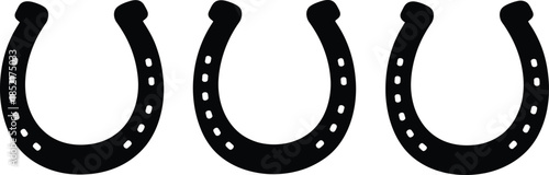 Three black horseshoes in a row isolated on a white background