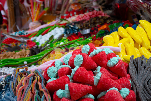 Fotografie sugary candy stall at colorful street fair close-up