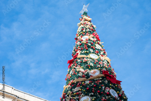 Colorfully decorated Christmas tree at Palazzo Ferreria near the Parliament of Malta in Valletta, with festive lights and strong holiday atmosphere Valletta, Malta, 6 DEC 2025.