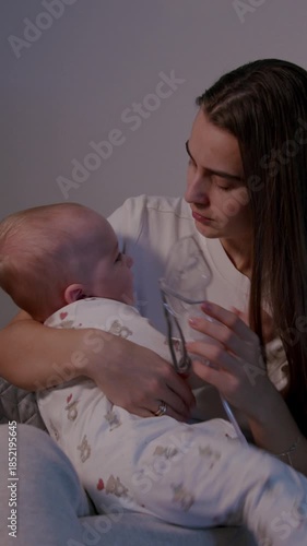 Mother soothing her baby during home nebulization treatment, showcasing emotional connection and care, camera pans to capture tender moments of comfort and support