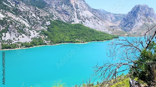 Dam lake in the Green Canyon in Turkey. Mountain lake Oymapinar. The Emerald reservoir behind the Oymapinar dam in the Manavgat region.View of the Taurus Mountains. 4К