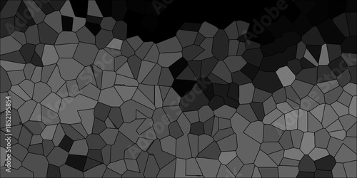 Grayscale abstract geometric mosaic with dark gray and black polygons creating a sophisticated textured background for design