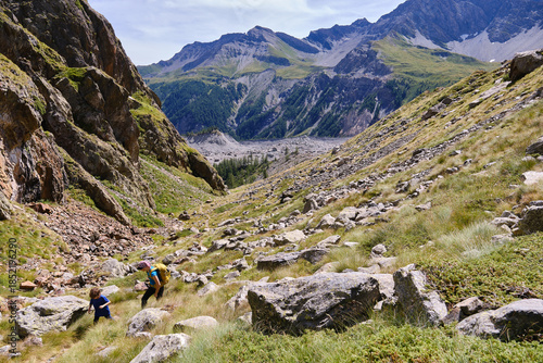 Mother and son hiking in the Italian Alps