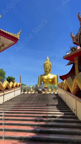 Pattaya, Chonburi, Thailand 25 June 2025. The Great Golden Buddha Temple Wat Phra Yai on the Phra Tamnak mountain hill. The 18-meter-high Buddha statue is covered with golden mosaic. 4К