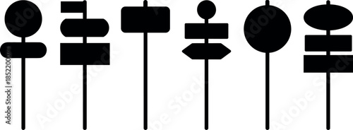 set of black silhouettes of various signs on poles for directions or information