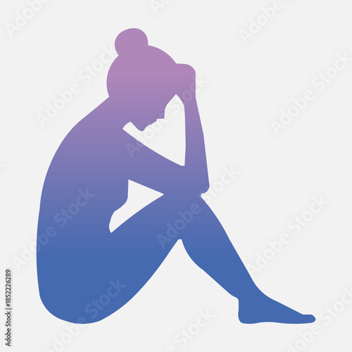 Silhouette of a woman sitting with her head in her hands, conveying sadness or contemplation