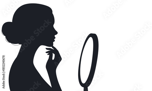 Silhouette of a woman looking in a mirror.