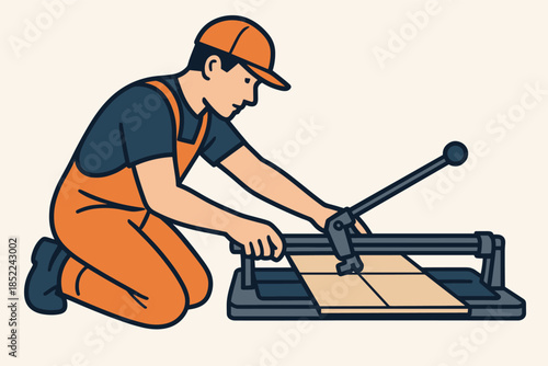 Male worker cutting tiles with tile cutter in orange coveralls